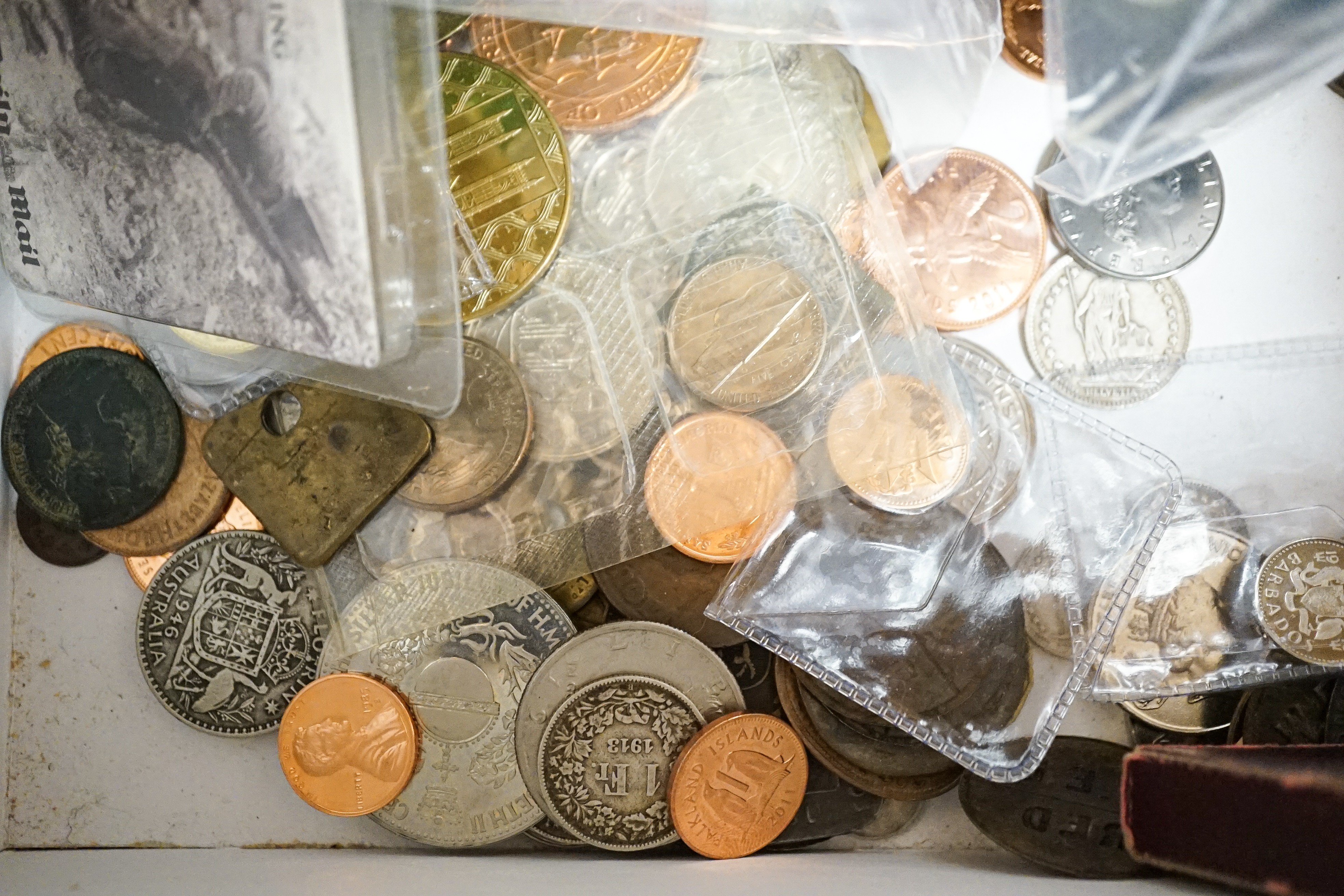 A collection of military badges and a collection of coins